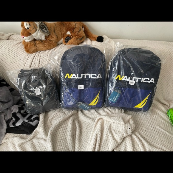 I have a few nautica bags the blue ones are larger the black one is smaller - Picture 2 of 2
